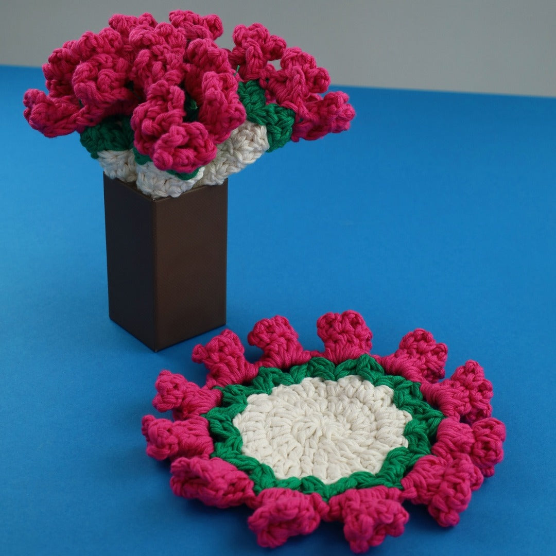Crocheted flower coasters on a blue background